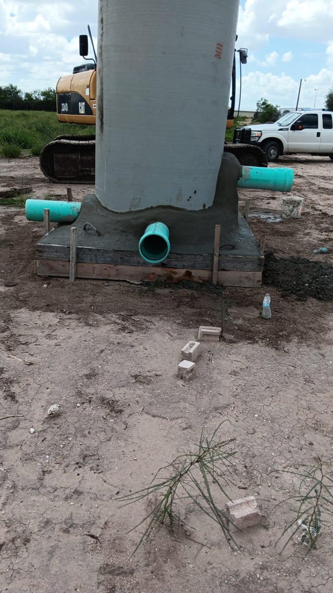 Manhole base construction